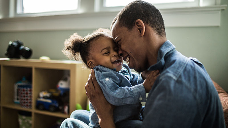 Toddler and father hugging